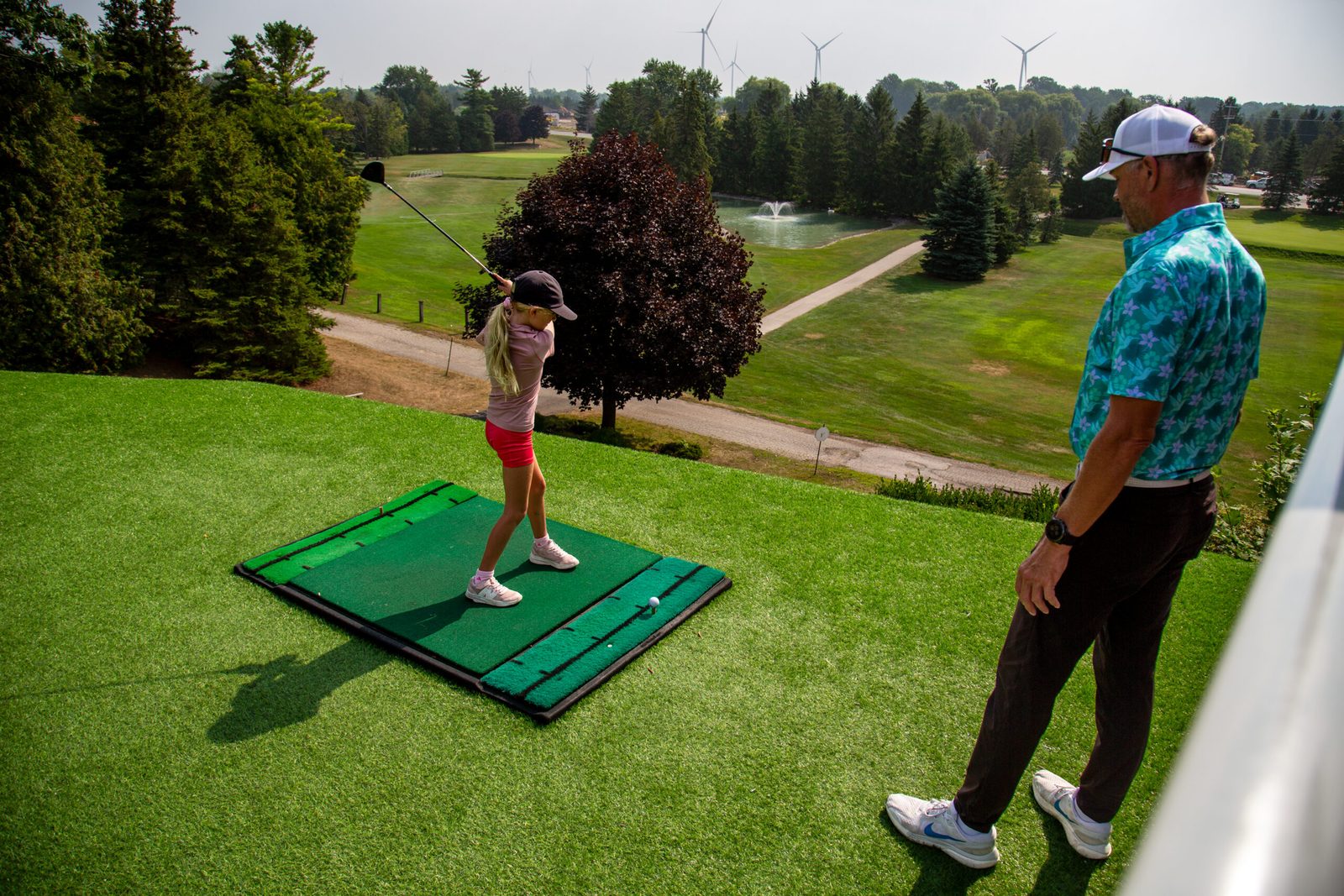 A camper working on her swing